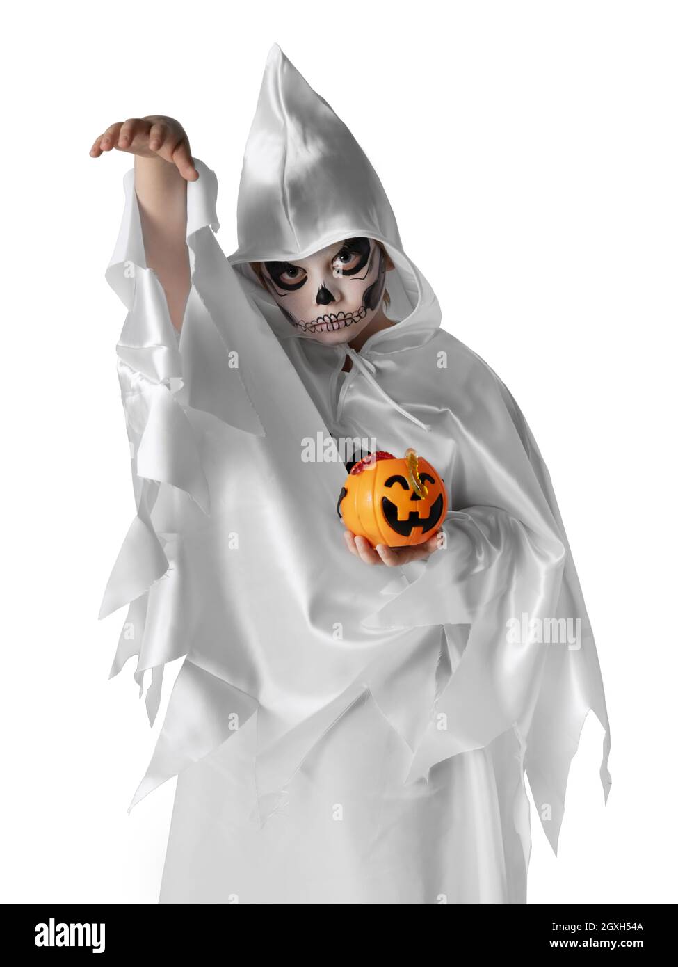 Funny halloween kid in costume with pumpkin sweets bucket, skeleton