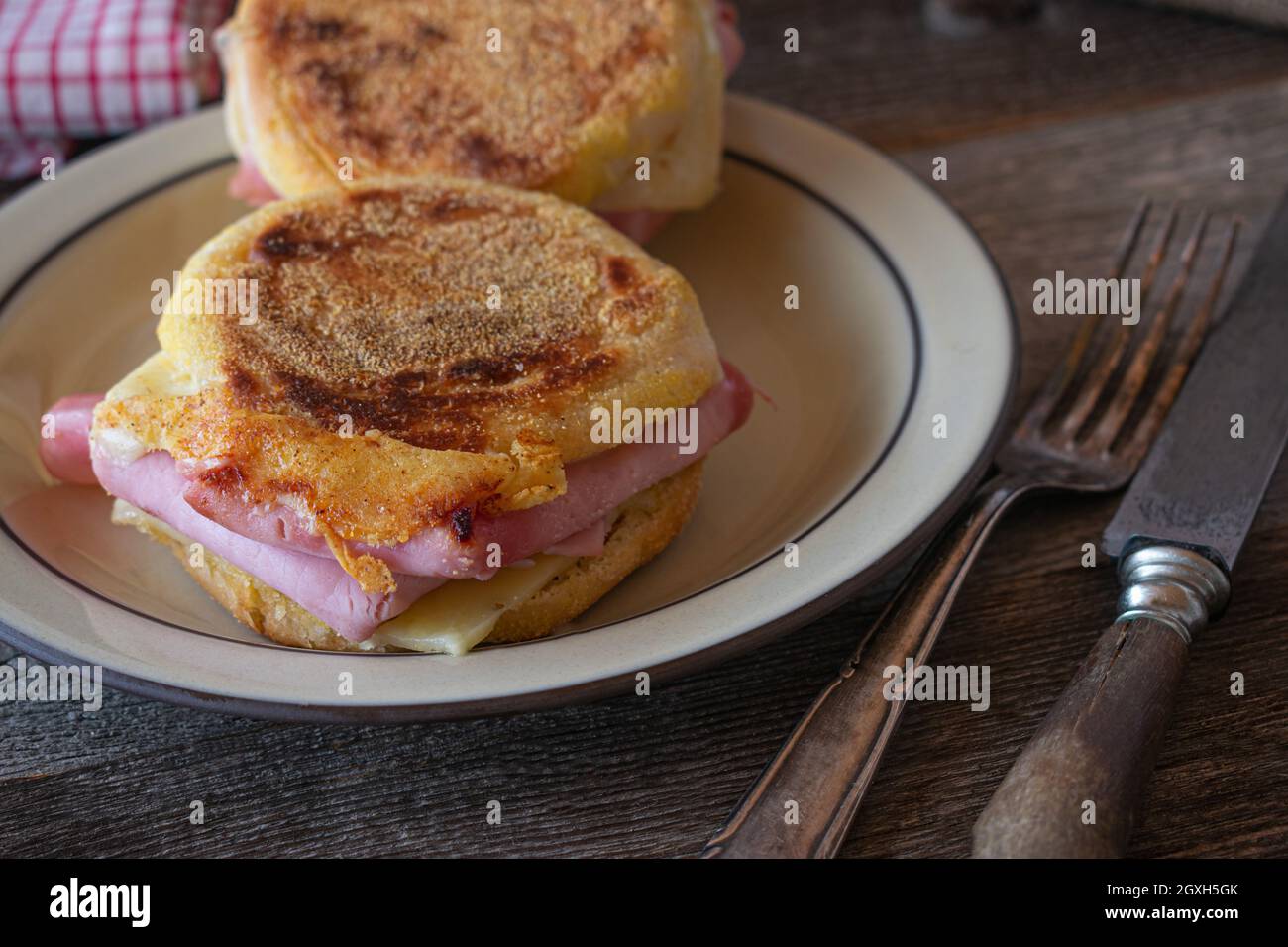 Grilled Ham and cheese sandwich made with english muffin. Stock Photo