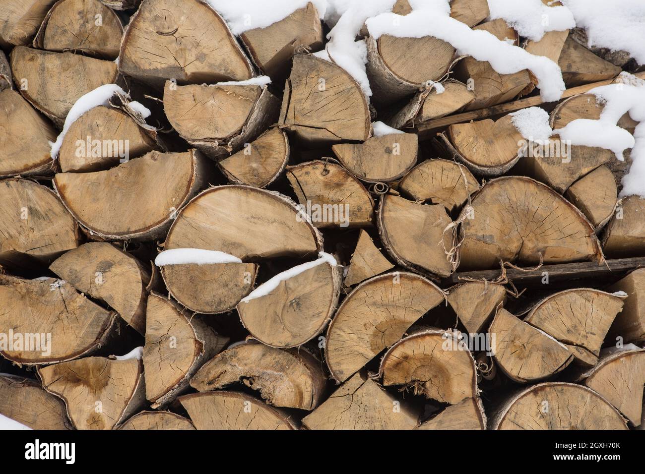 A pile of birch wood. prepared for the winter for kindling the village stove. Stock Photo