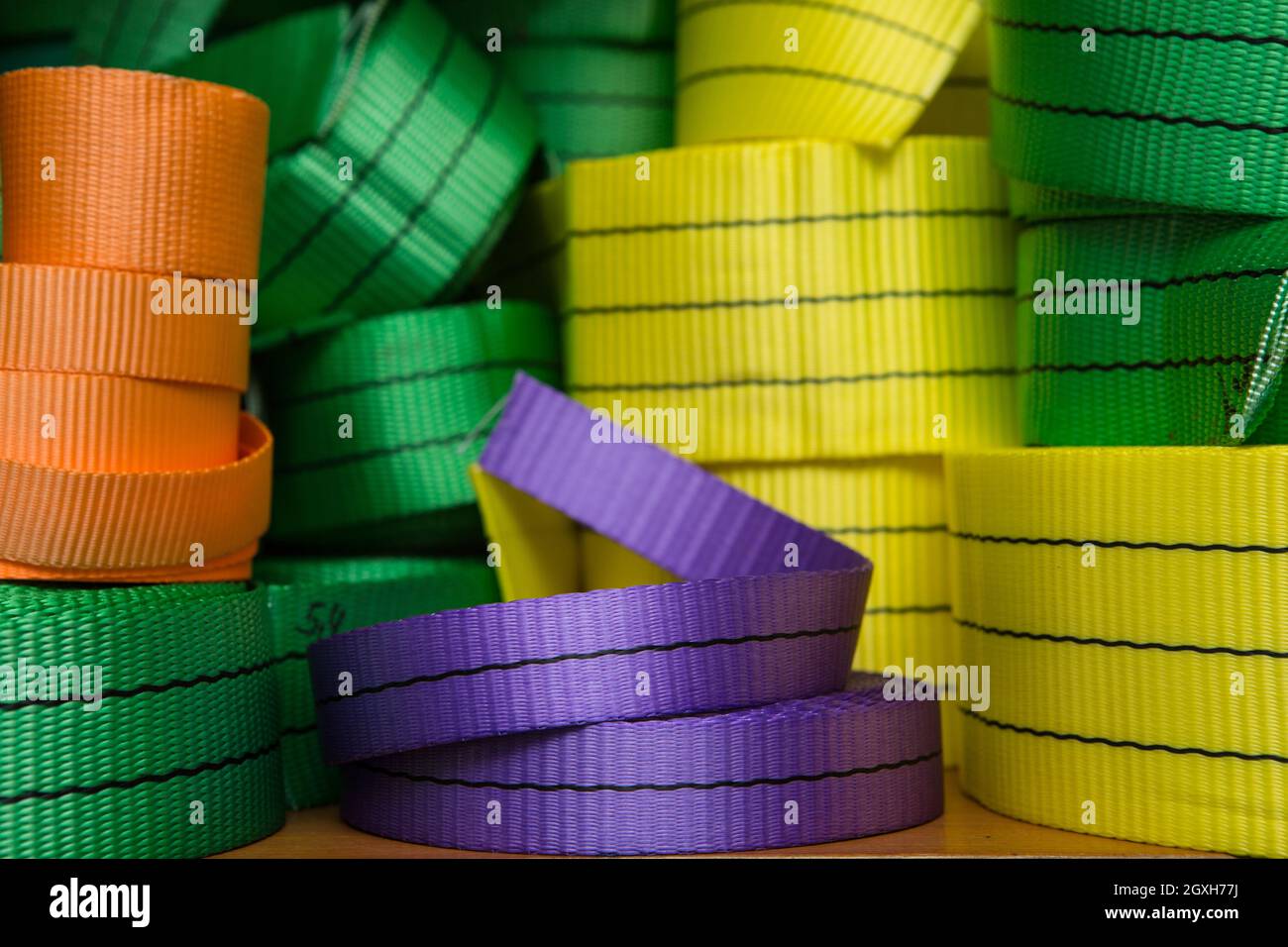 Industrial sewing machine sews a webbing sling. Manufacture of textile