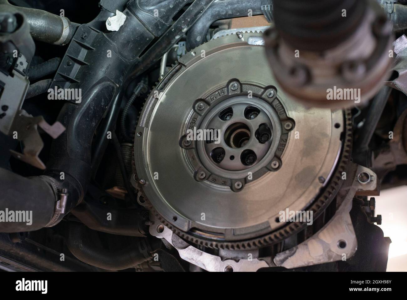 Detail of Car flywheel assembly in a workshop, car reparation engine Stock  Photo - Alamy