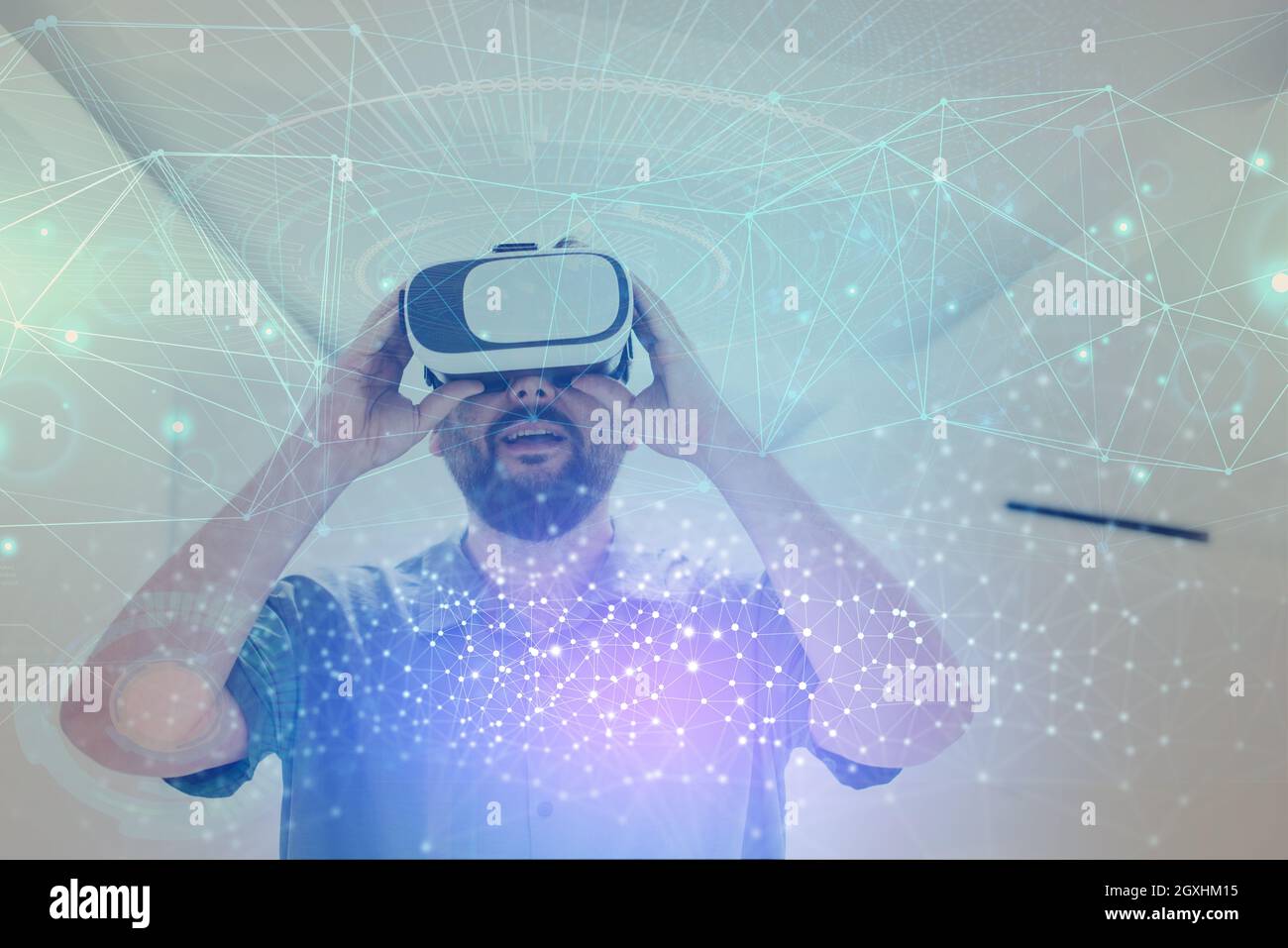 man trying virtual reality vr glasses at modern home with futuristic neural  network dots graphic design Stock Photo - Alamy
