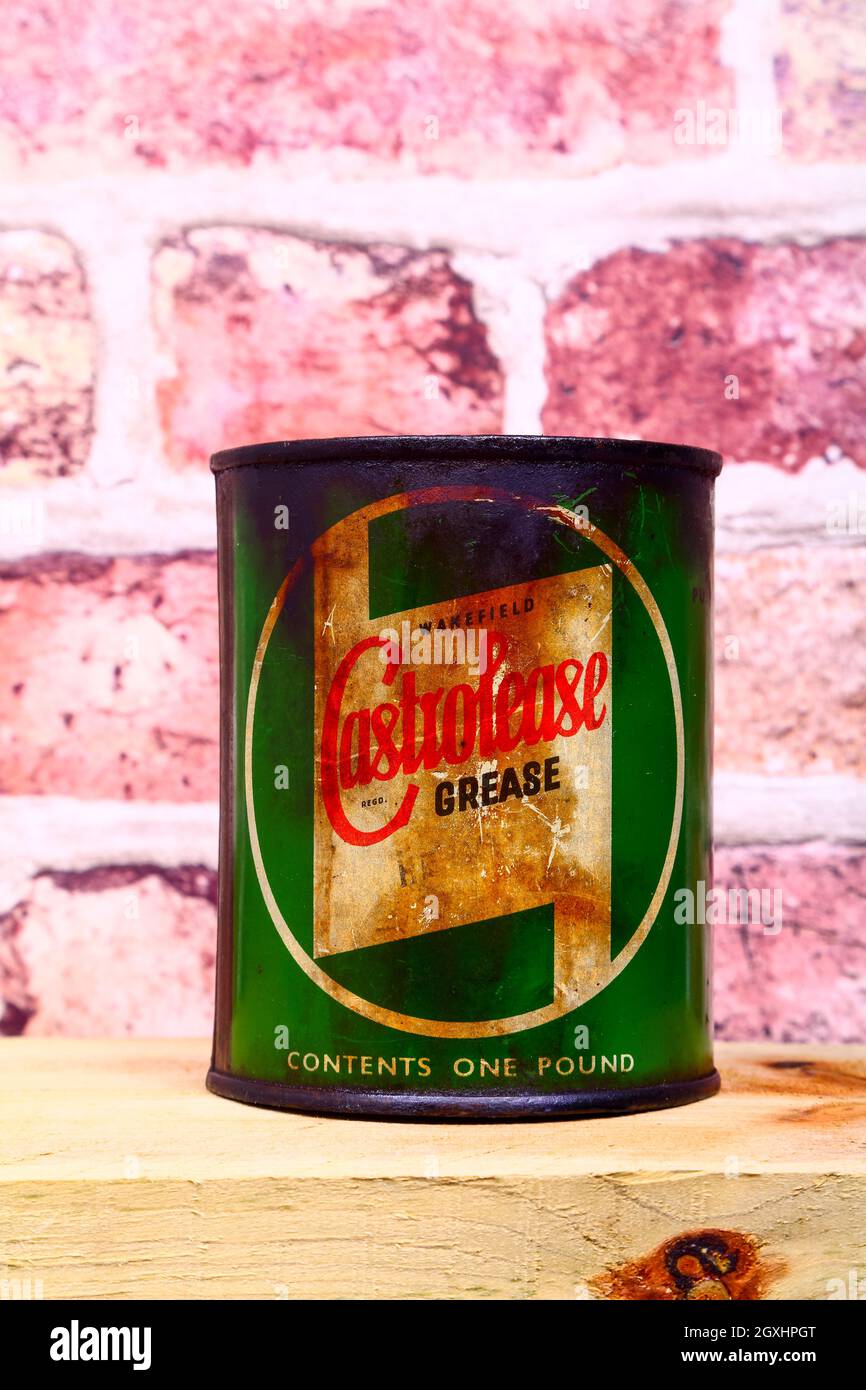 Vintage one pound can of Castrol grease isolated on a wooden shelf Stock Photo