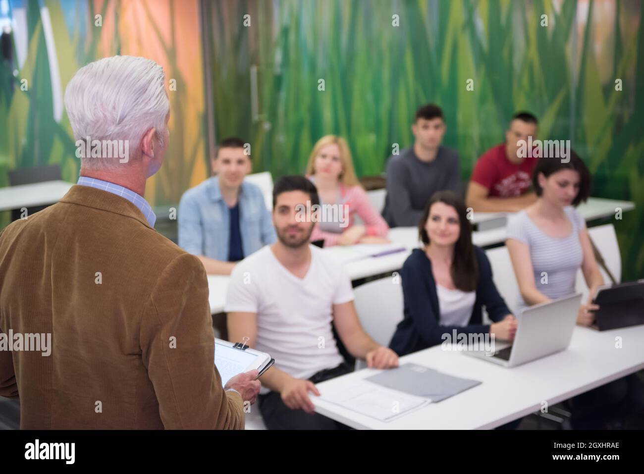 group of students study with professor in modern school classroom Stock ...