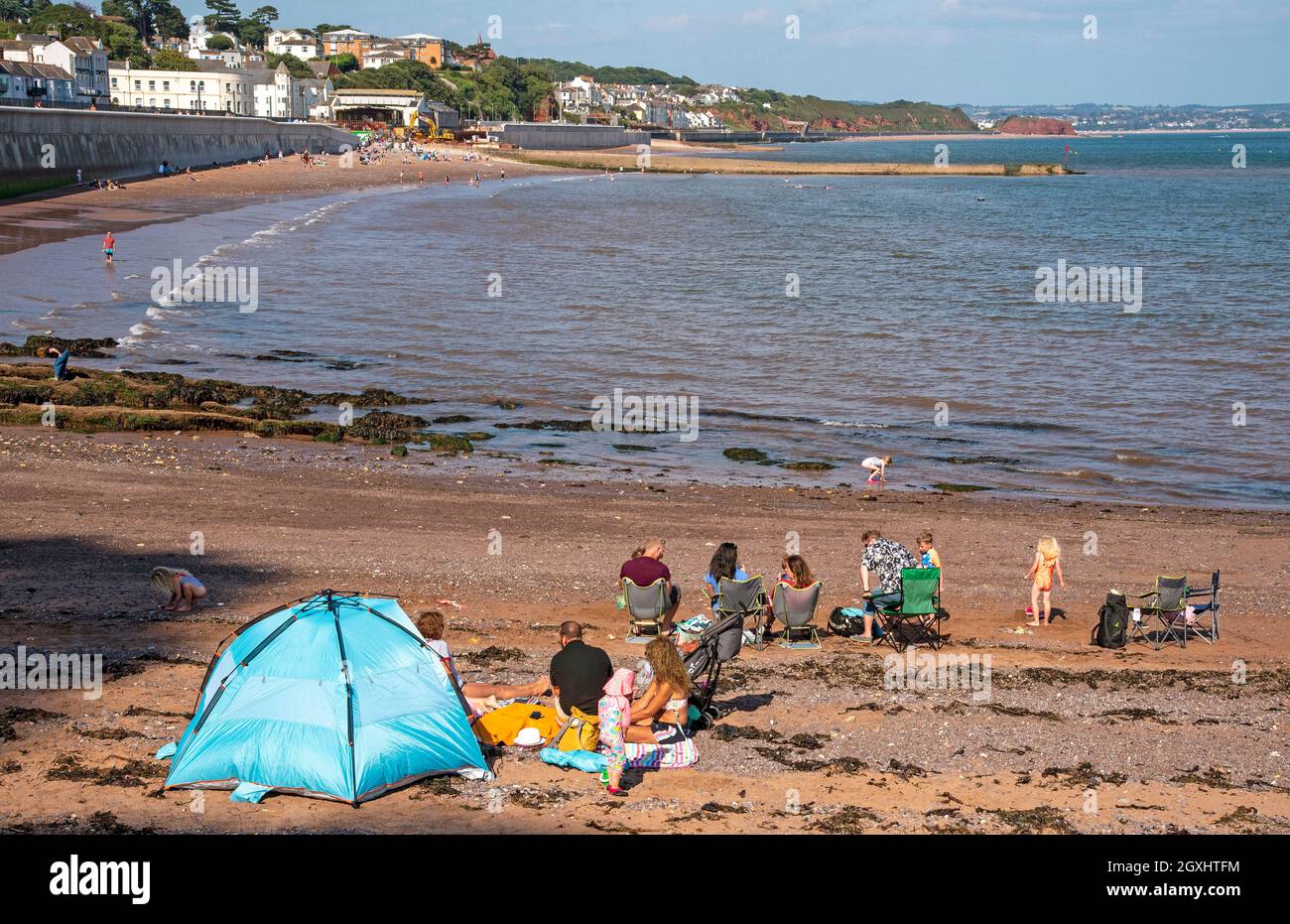 Dawlish, Devon, England, UK. 2021. Families on the beach at low tide in ...