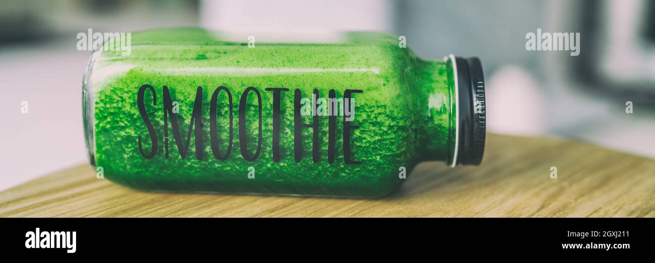 Green smoothie healthy eating drink detox celery juice diet bottle with text title SMOOTHIE for to go breakfast beverage panoramic banner. Stock Photo