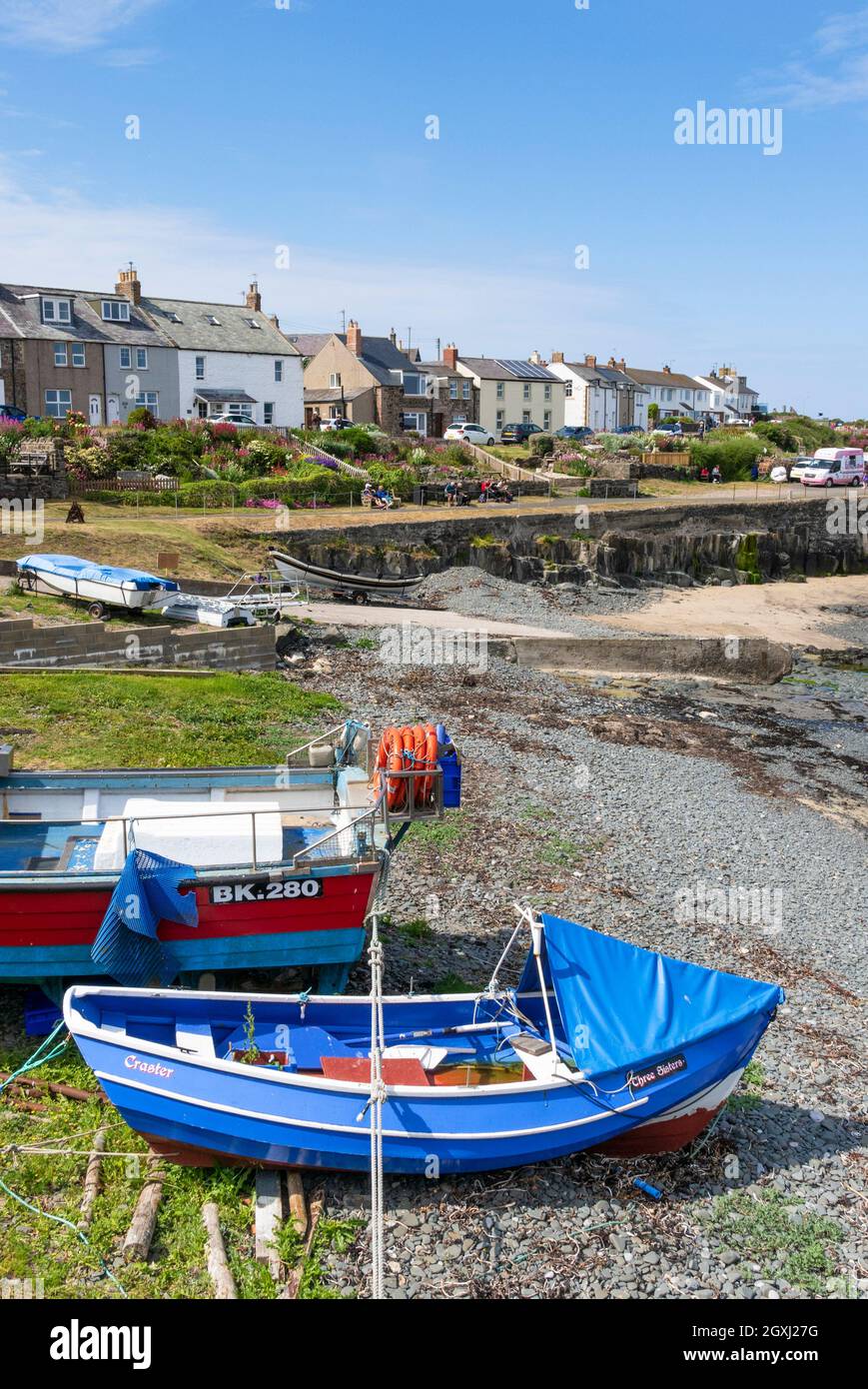 Fishing boats in the harbour in the coastal village of Craster Village Northumberland coast Northumbria Northumberland England GB UK Europe Stock Photo