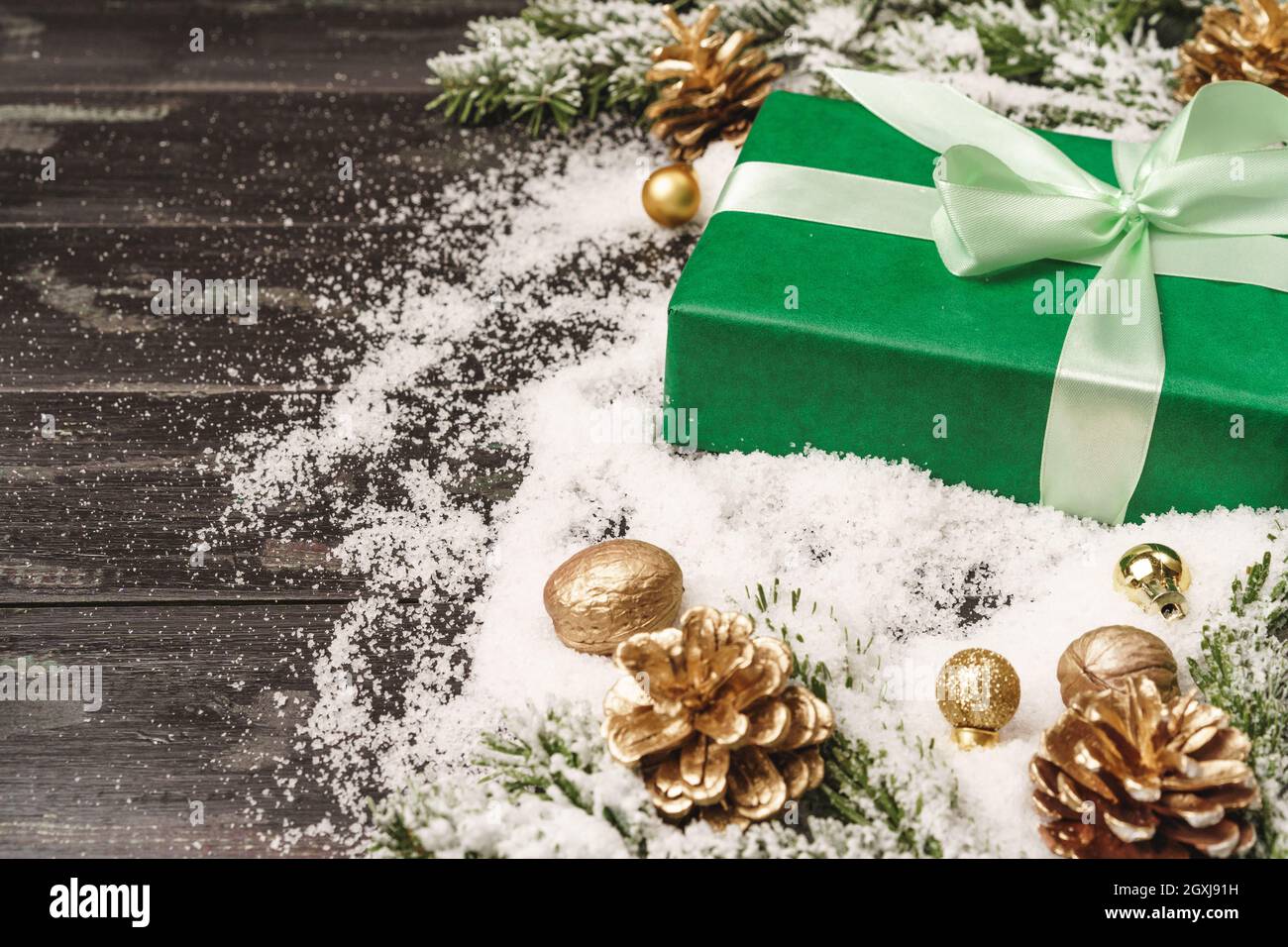 Winter holidays background with wrapped gift and copy space Stock Photo -  Alamy
