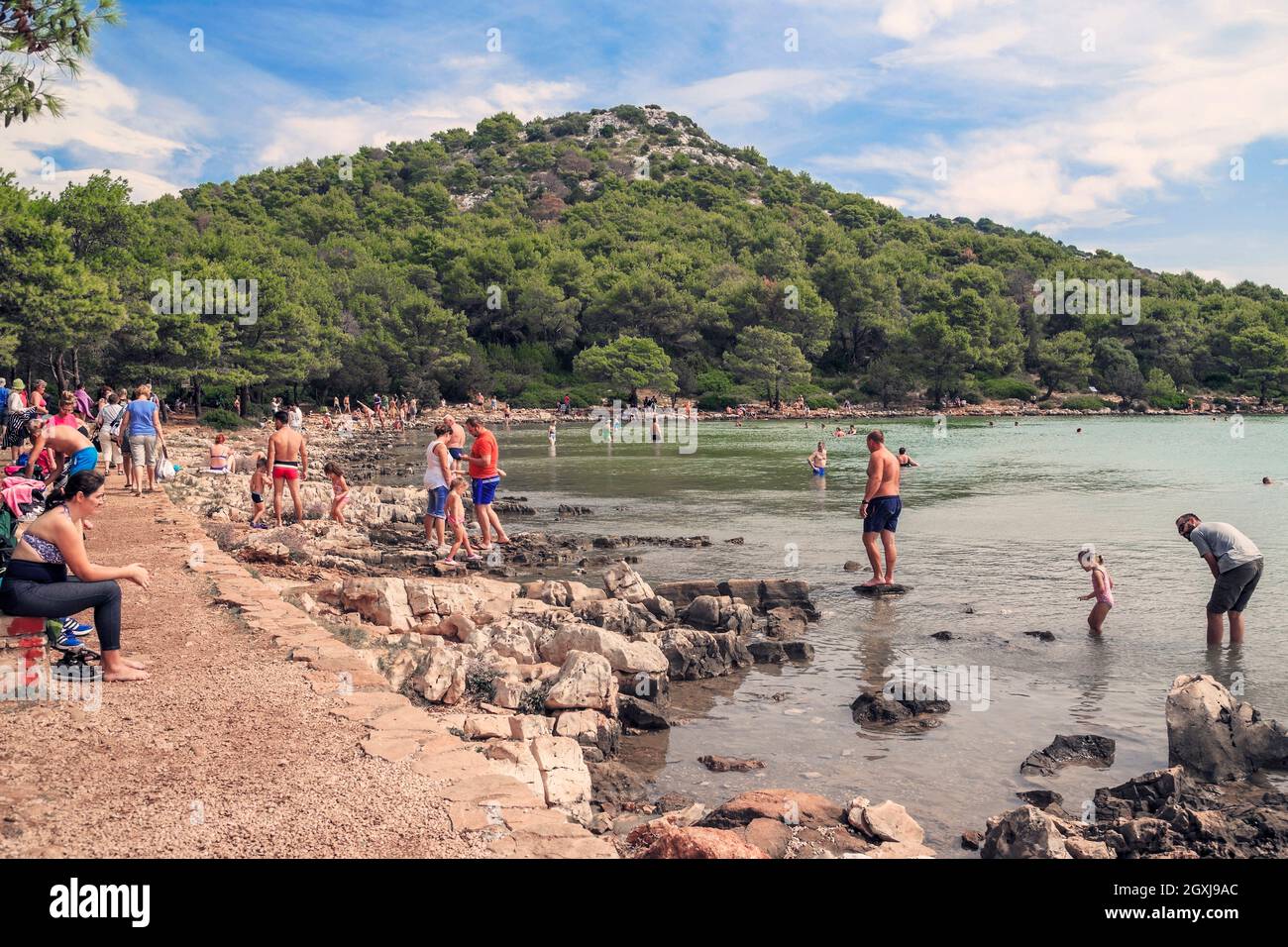 DUGI OTOK, CROATIA - SEPTEMBER 7, 2016: This is rest with a dip in the salt lake Mir in the Telascica Nature Park. Stock Photo