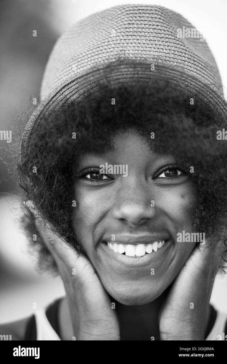 Close up portrait of a beautiful young african american woman smiling ...
