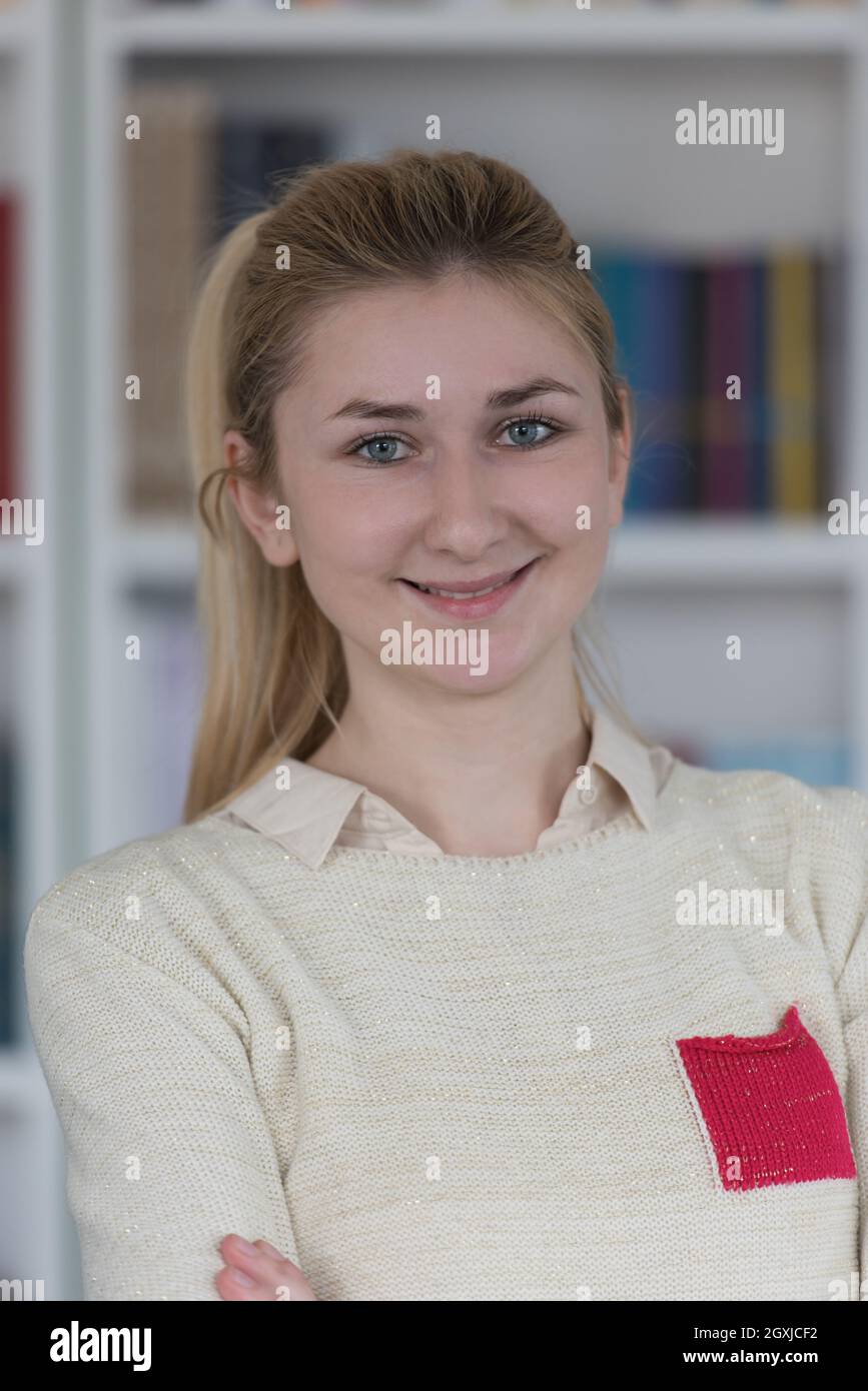 portrait of happy smilling female student girl in school library Stock ...
