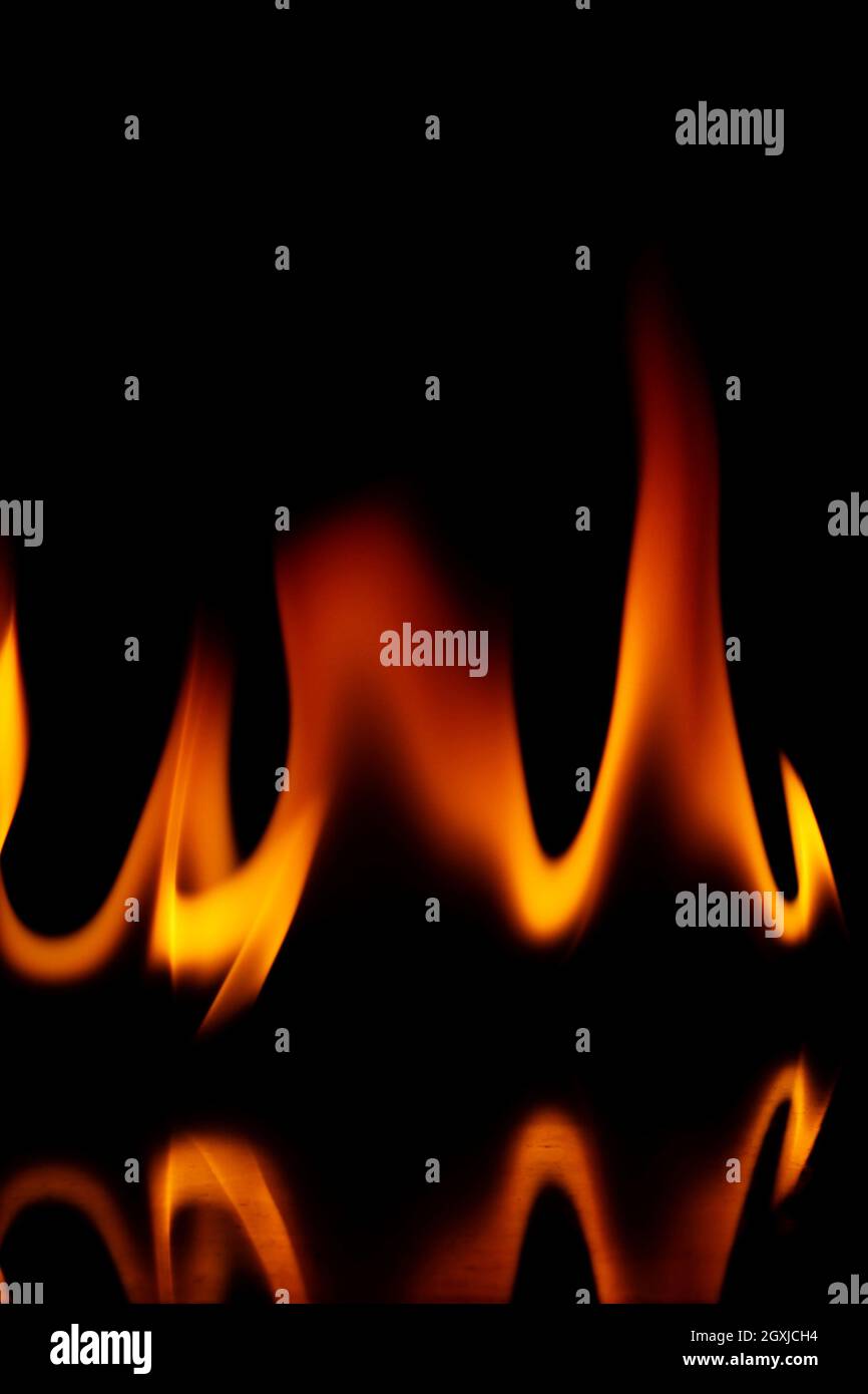 Fire flames isolated on a black background Stock Photo - Alamy