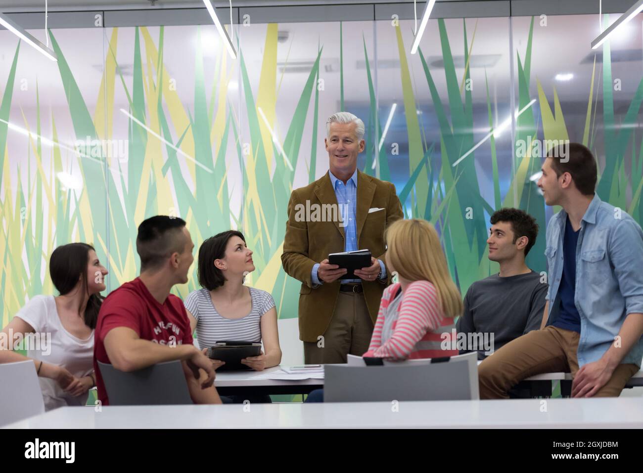 group of students study with professor in modern school classroom Stock ...