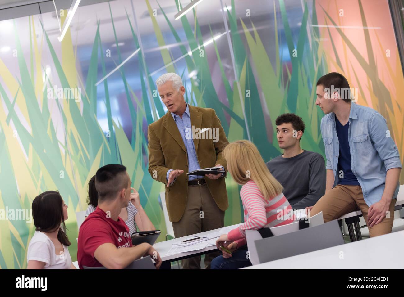 group of students study with professor in modern school classroom Stock ...