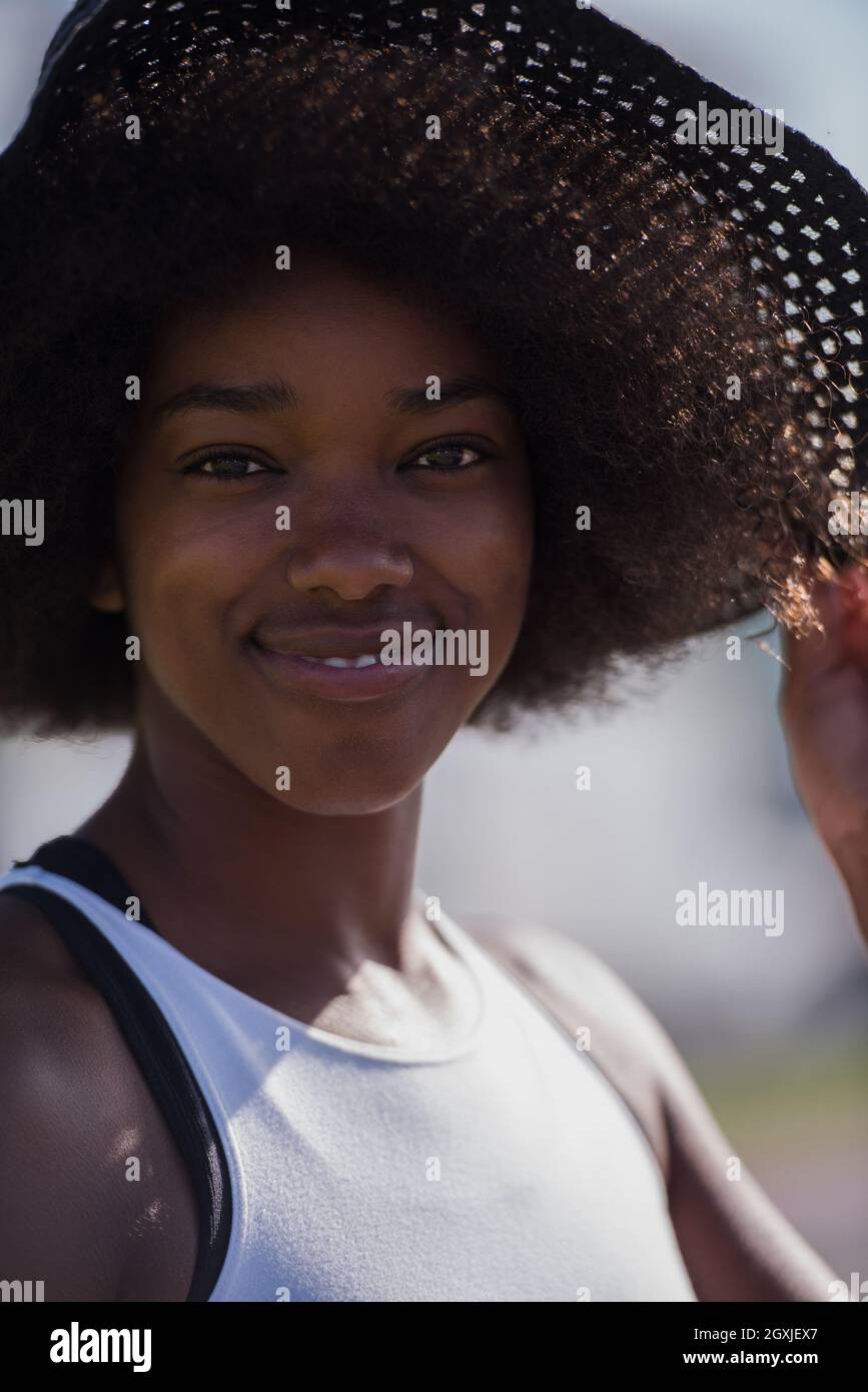 Close up portrait of a beautiful young african american woman smiling ...