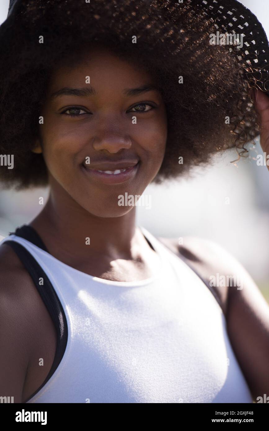 Close up portrait of a beautiful young african american woman smiling ...