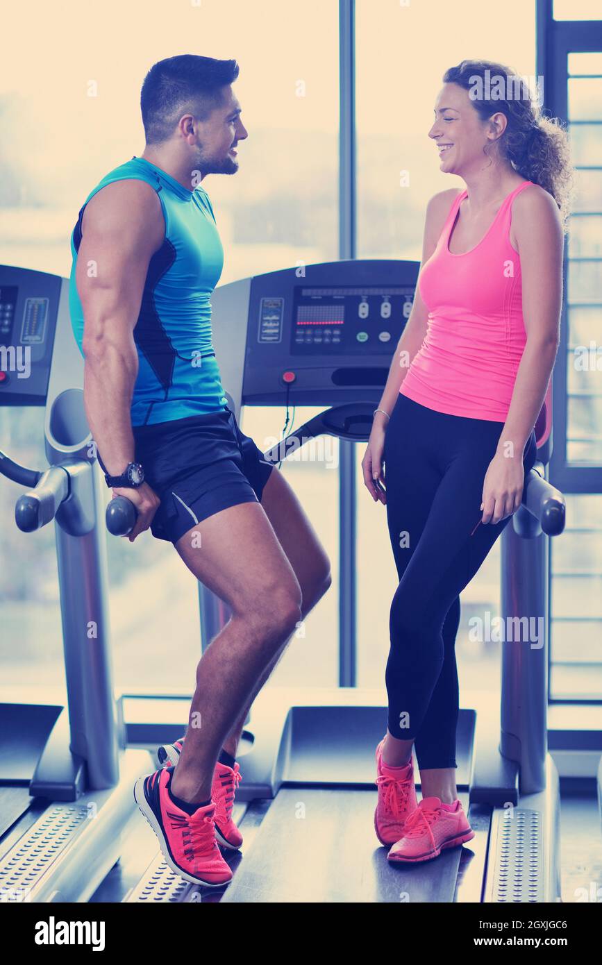attractive couple at the gym looking happy Stock Photo - Alamy