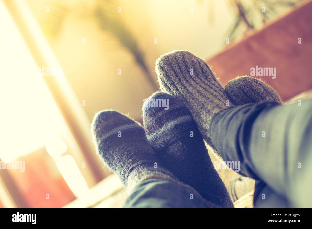 Feet on couch hi-res stock photography and images - Alamy