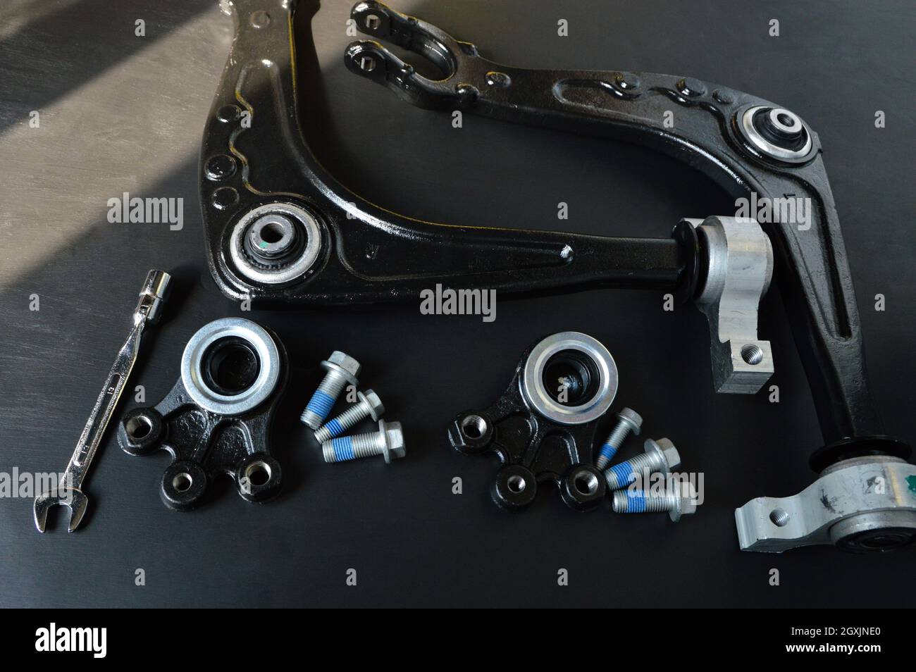 Auto parts to replace the suspension triangle of a car Stock Photo Alamy
