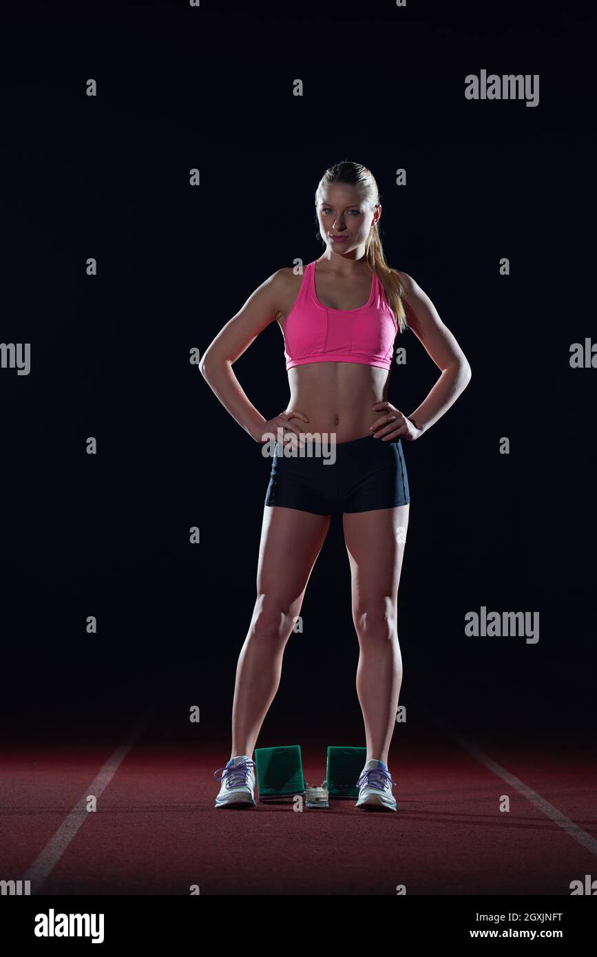 Female sprinter leaving starting blocks hi-res stock photography and ...