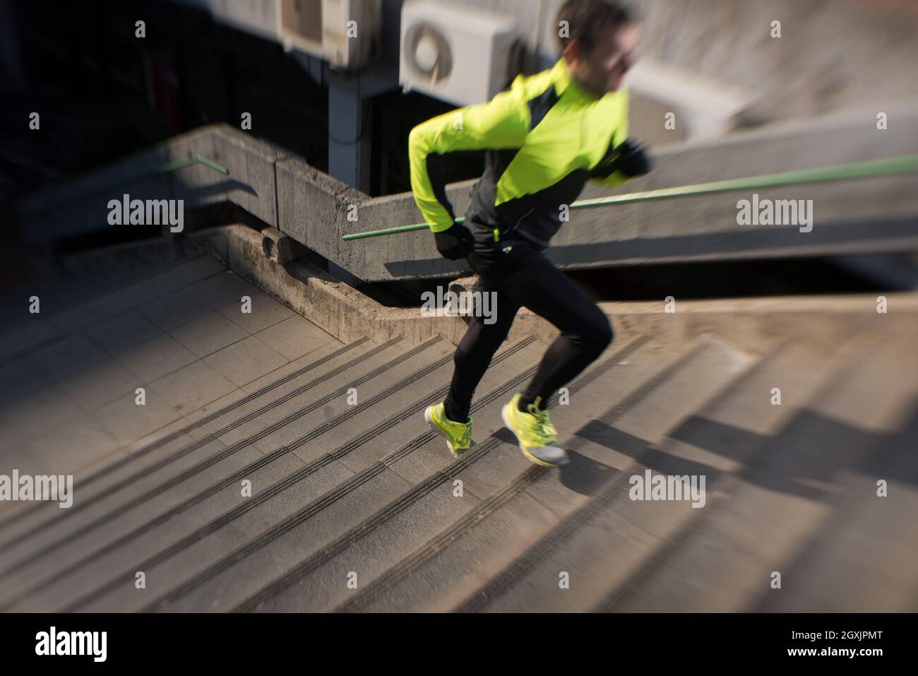 man jogging at cold autumn mornigng on steps Stock Photo Alamy