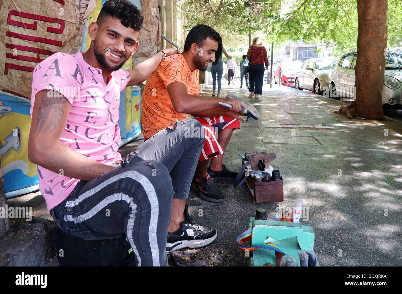 Syrian young men clean shoes in a street of Beirut, Lebanon, on September  29, 2021. According to UNHCR, life of refugees is worsening despite  increased assistance. The preliminary findings of the 2021