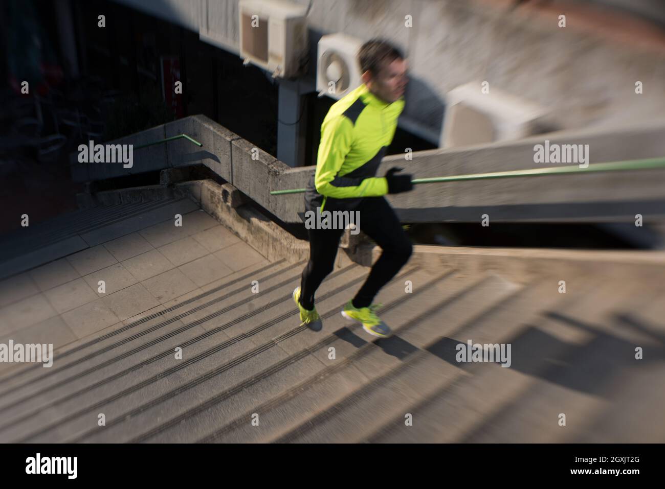man jogging at cold autumn mornigng on steps Stock Photo Alamy