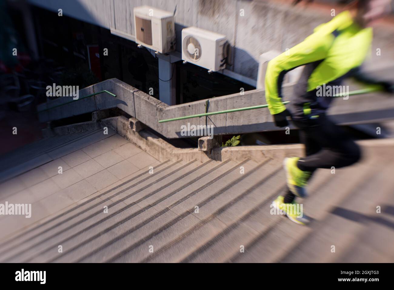 man jogging at cold autumn mornigng on steps Stock Photo Alamy