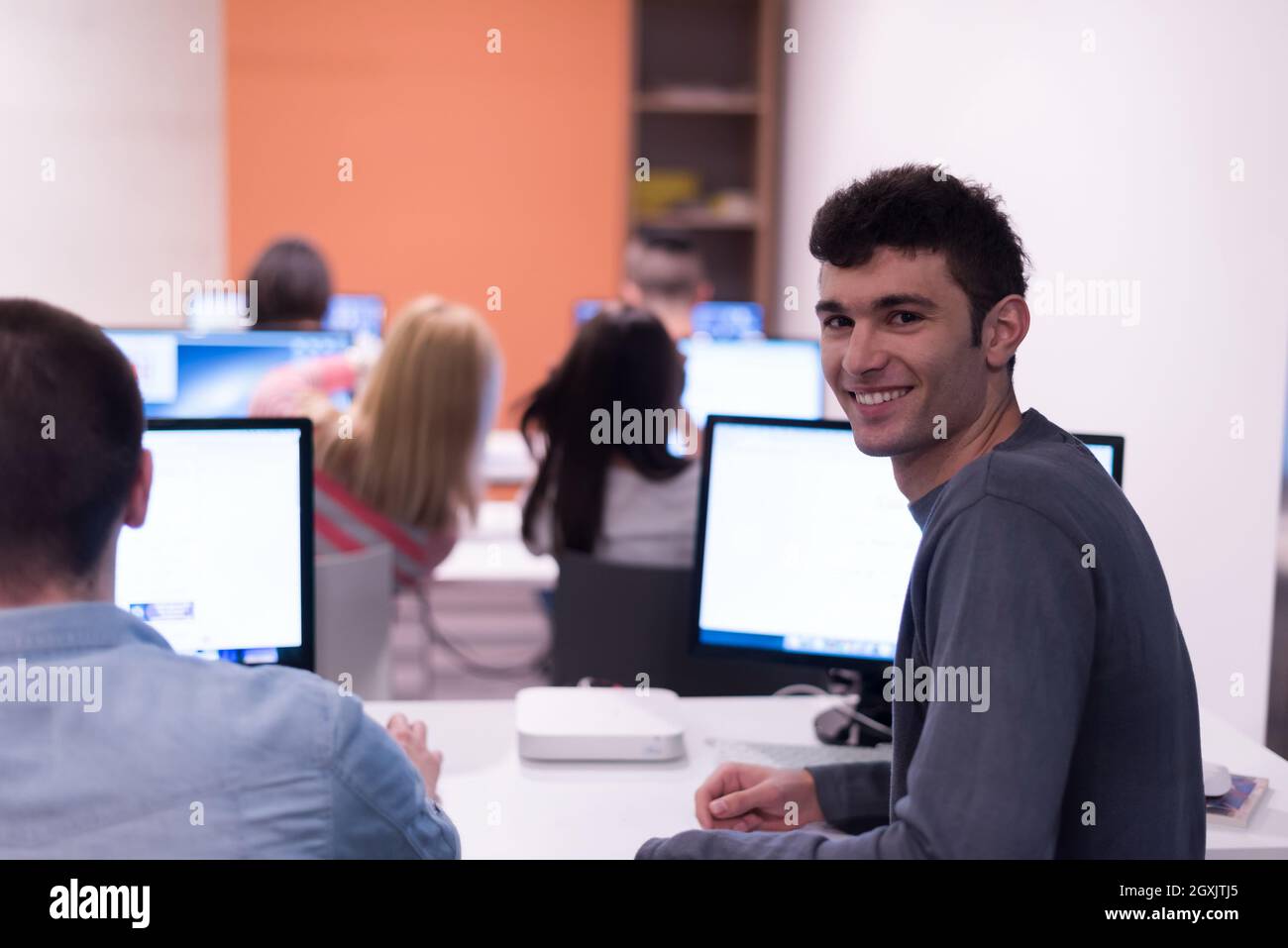 technology students group in computer lab school classroom working on ...