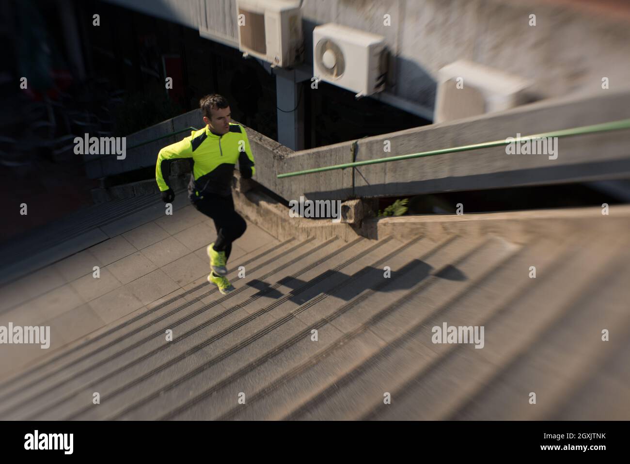man jogging at cold autumn mornigng on steps Stock Photo Alamy