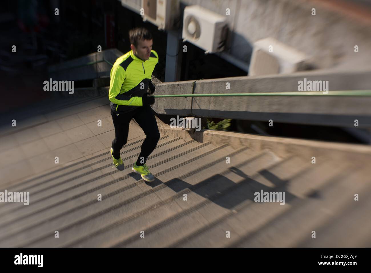 man jogging at cold autumn mornigng on steps Stock Photo Alamy
