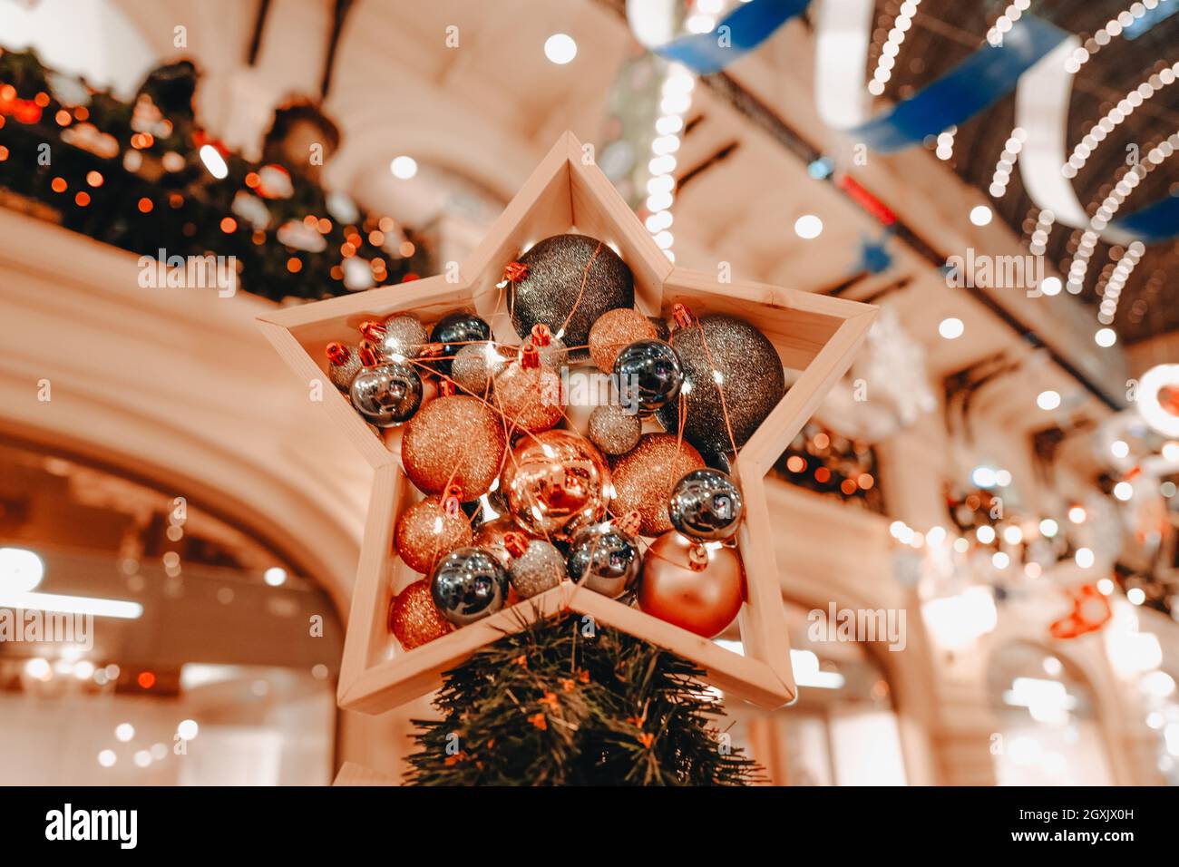 Christmas In Comfort 2022 Golden Christmas Decoration On The Christmas Tree. Toy In The Form Of A  Shiny Star With Balls. Merry Christmas And Happy New Year 2022 Magic Stock  Photo - Alamy