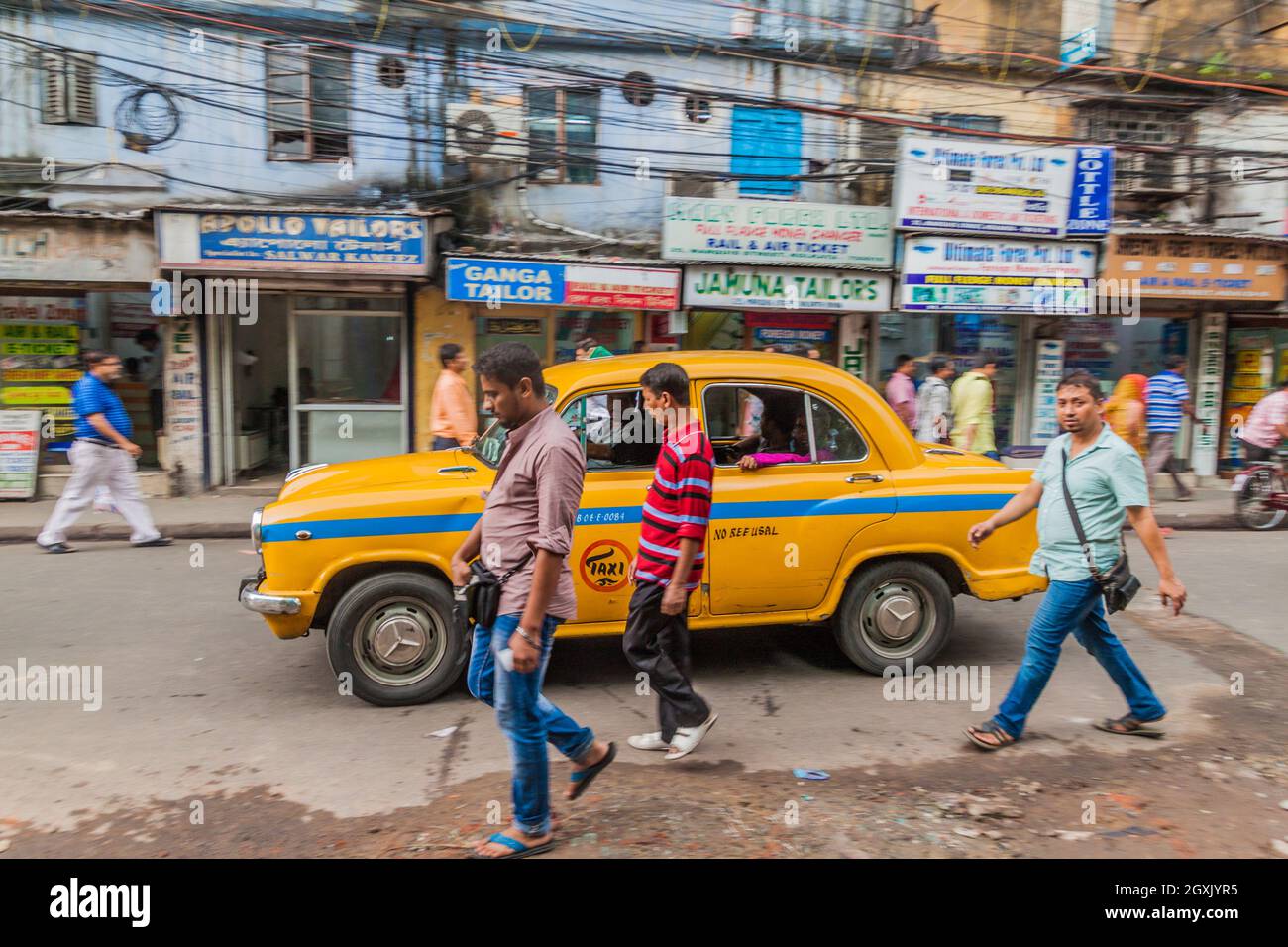 KOLKATA, INDIA - OCTOBER 27, 2016: View of yellow Hindustan Ambassador taxi in the center of Kolkata, India Stock Photo