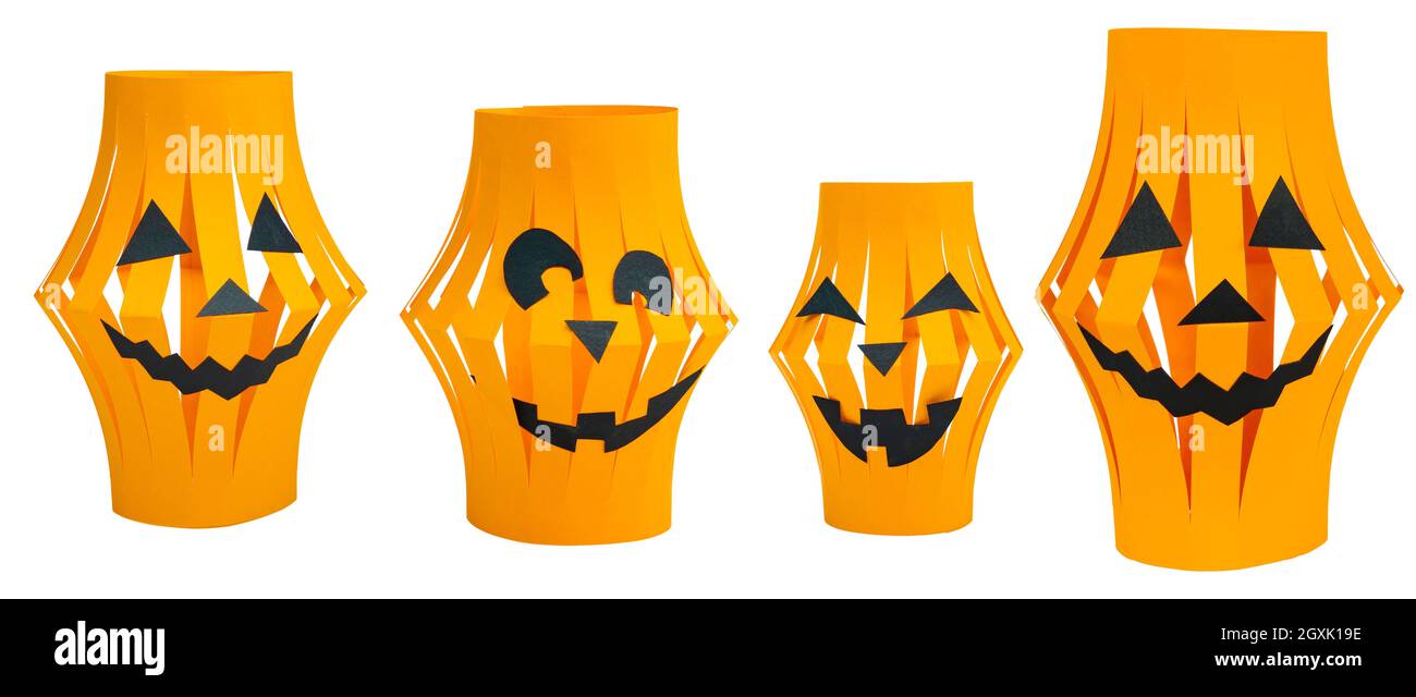 Halloween paper lanterns set isolated on white background. Orange paper lanterns in the form of laughing scary pumpkins. Halloween craft ideas for kid Stock Photo