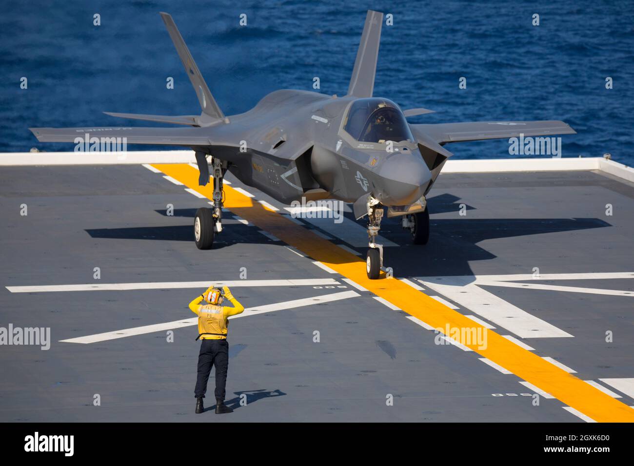 A U.S. Marine Corps F-35B Lightning II stealth fighter jet with Marine Fighter Attack Squadron 242, prepares for take off on the flight deck of the Japanese helicopter aircraft carrier JS  Izumo during joint operations October 3, 2021 off the coast of Japan. The F-35B Lightning II fighter became the first U.S F-35 operations aboard a Japanese vessel. Stock Photo