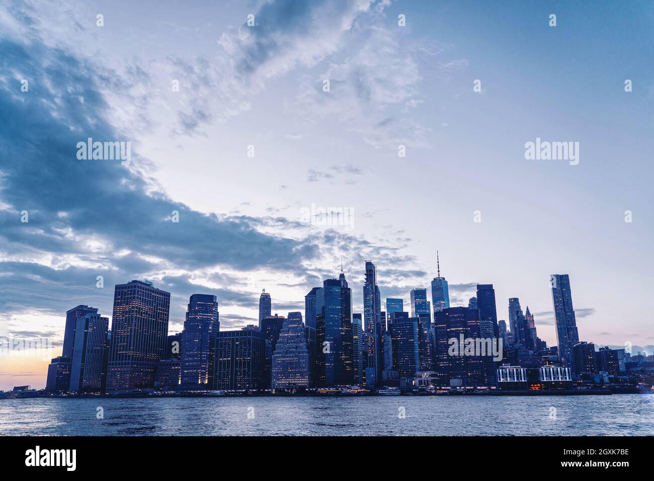 Financial district cityscape at sunset with 120 Wall Street, Continental Center and Freedom Tower, Manhattan, New York, USA Stock Photo