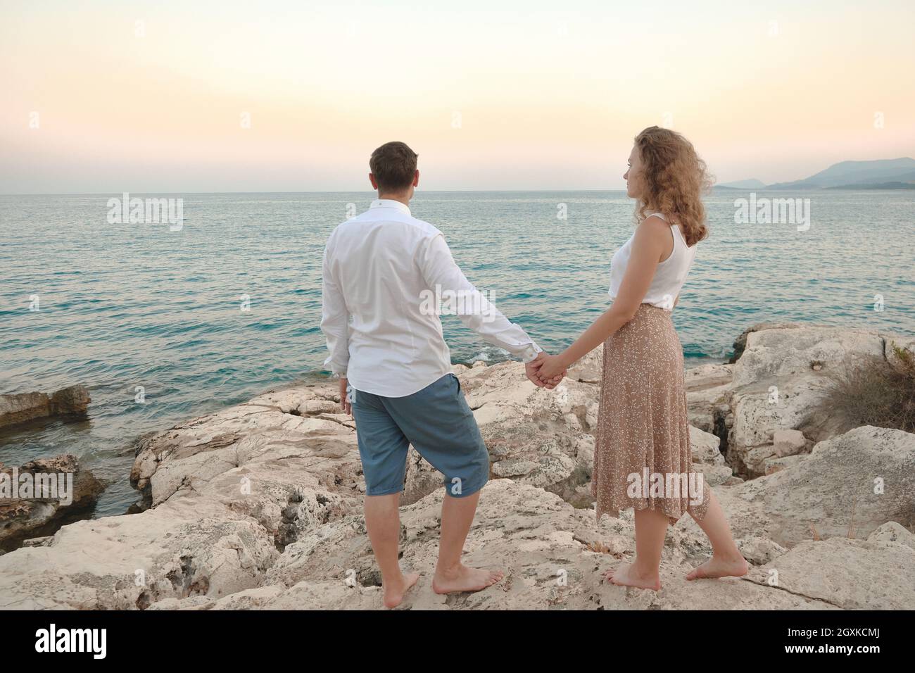 Man and woman holding hands Stock Photo