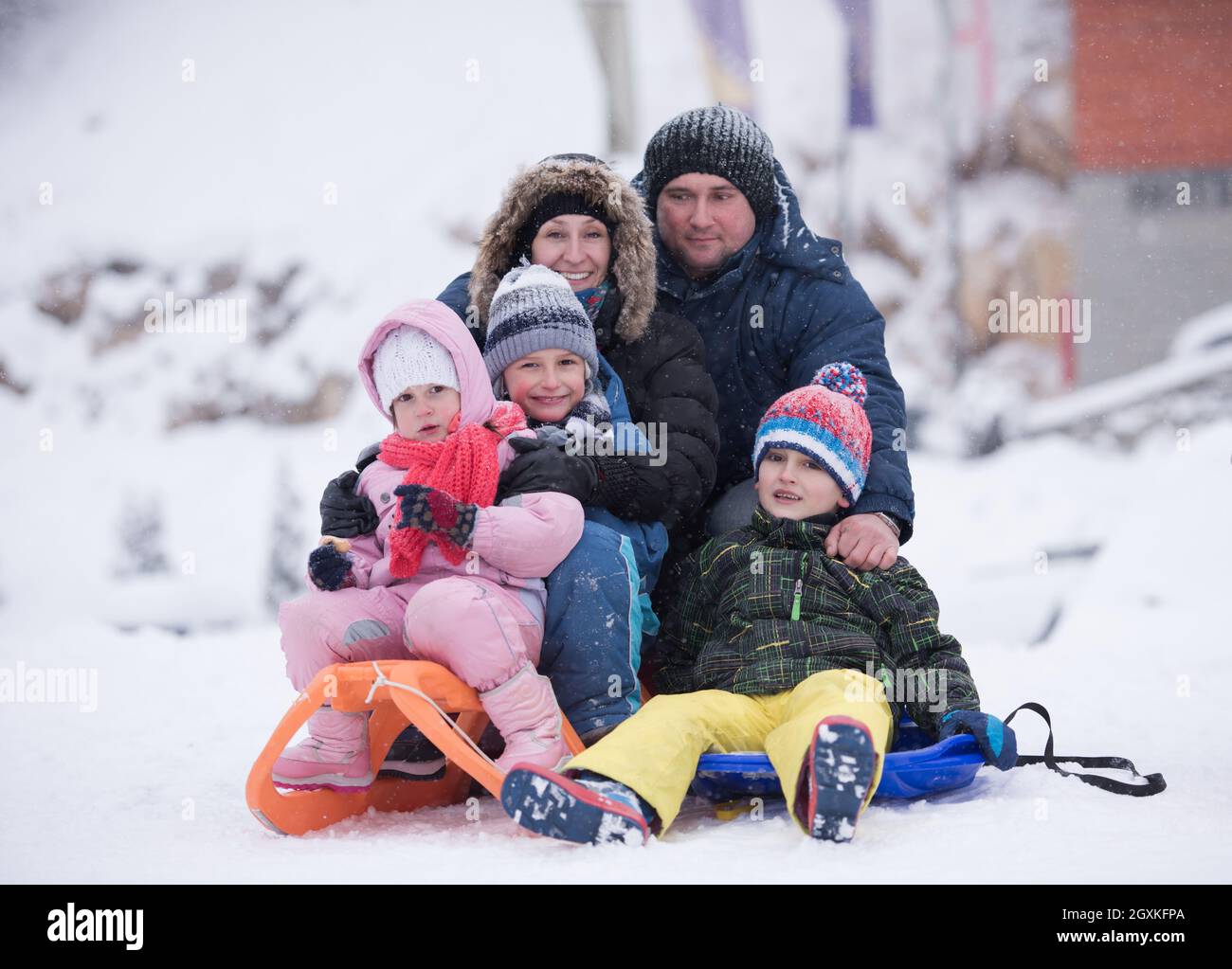 group of children having fun and play together in fresh snow on winter ...