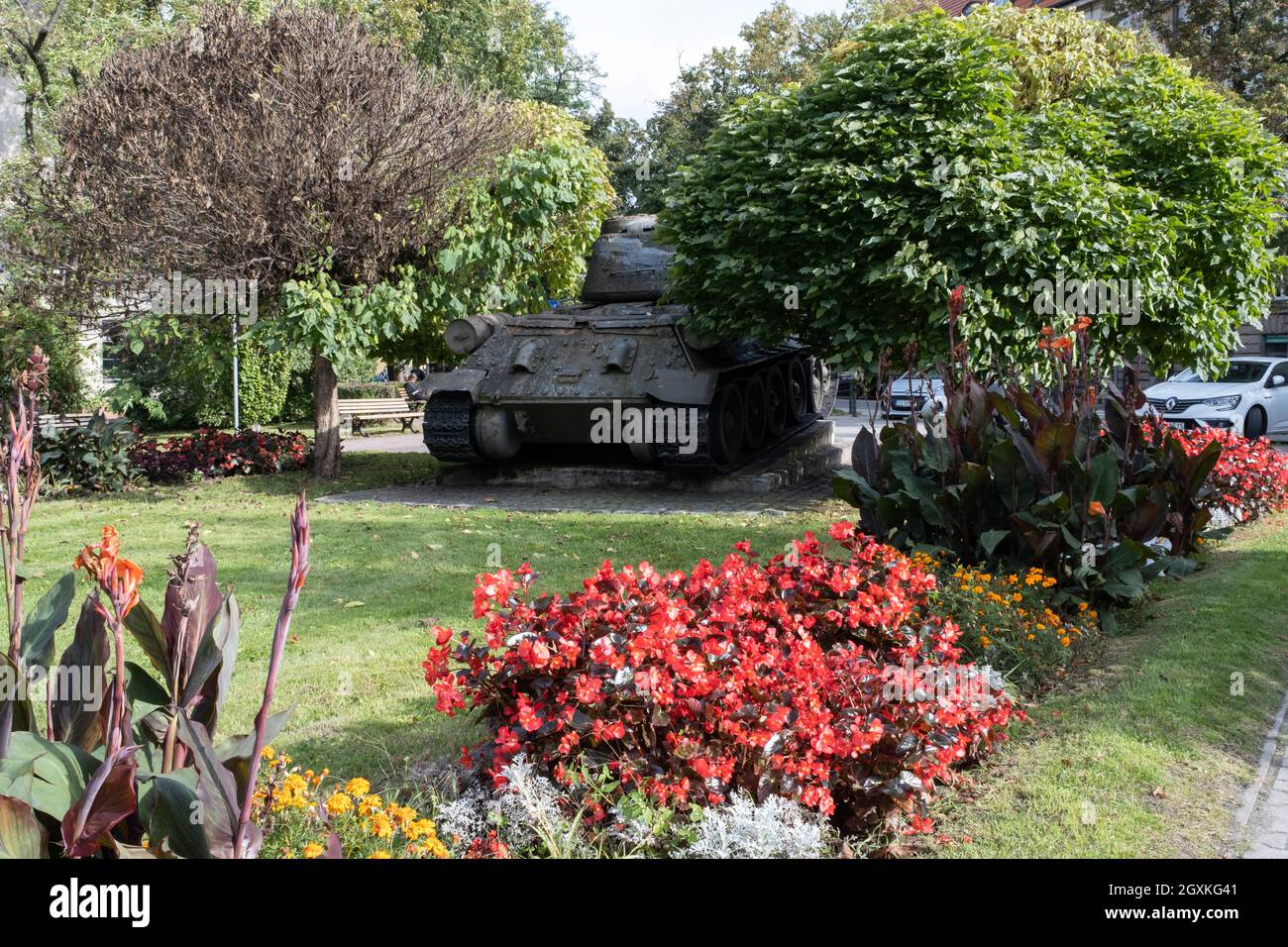 Gliwice, Poland - September 24, 2021. This Soviet T-34 85 tank was part of the Red Army force, which liberated Gliwice in 1945. Many war damages on it Stock Photo