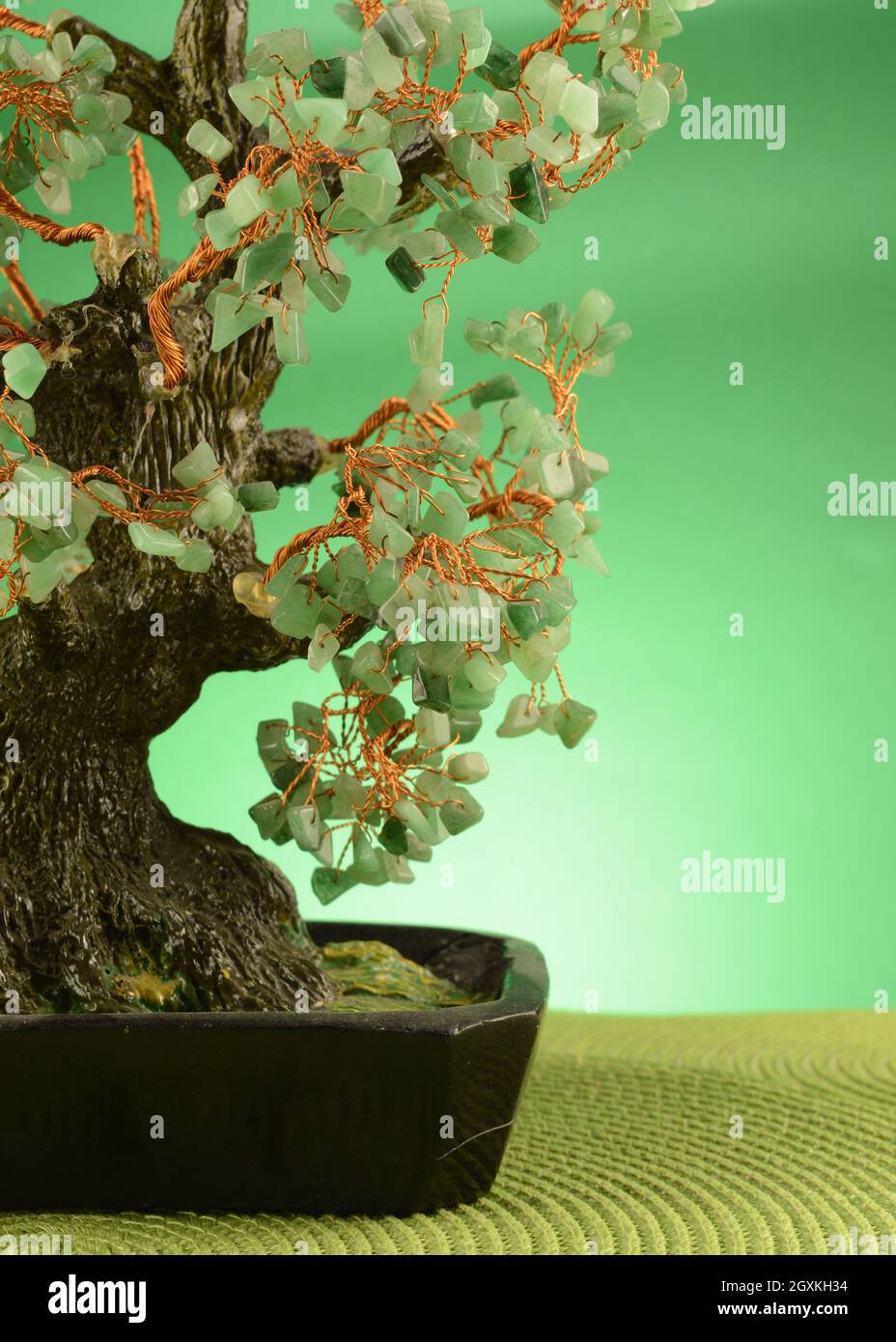 A closeup of a green jade stone money tree in a green surrounding  environment to enrich viewers with the law of attraction and wealth Stock  Photo - Alamy