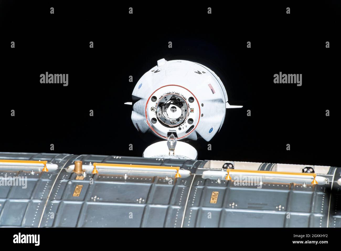 The SpaceX Cargo Dragon vehicle approaches the International Space Station for an autonomous docking to the Harmony module forward docking adapter August 30, 2021 in Earth Orbit. Stock Photo