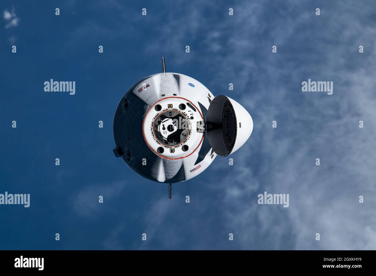 The SpaceX Cargo Dragon vehicle approaches the International Space Station for an autonomous docking to the Harmony module forward docking adapter August 30, 2021 in Earth Orbit. Stock Photo