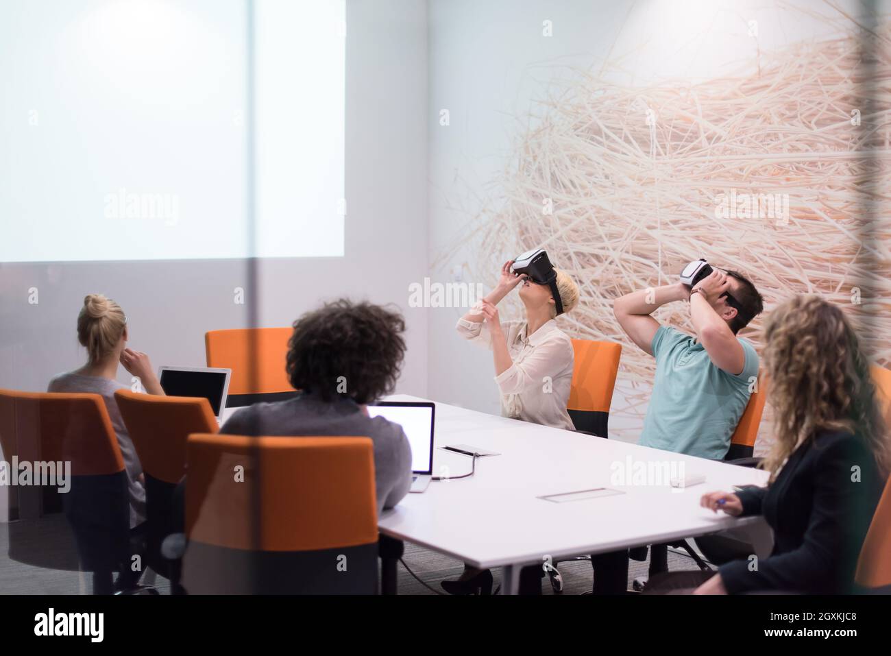 Meeting Simulation startup Business team using virtual reality headset in night office ...