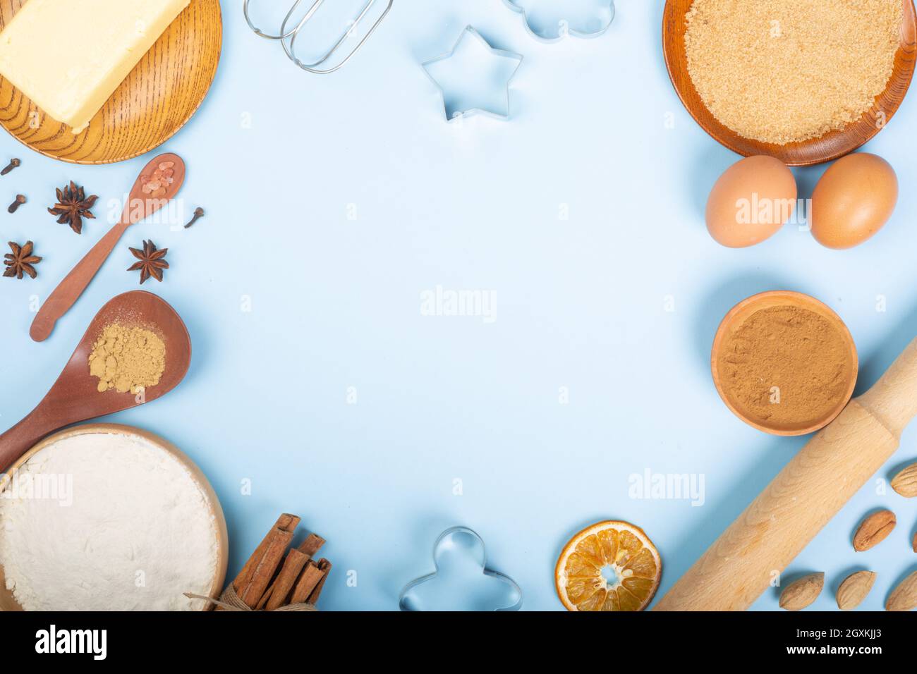 Christmas food background frame.Culinary background for a Christmas baking  recipe, cookie molds, ingredients, spices, top view, flat lay, copy space  Stock Photo