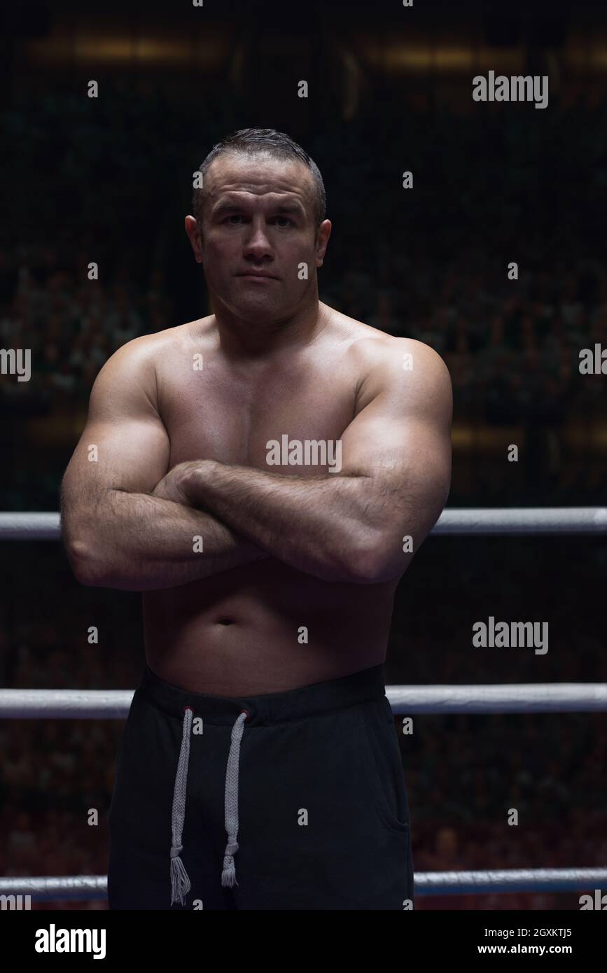 professional kickboxer with hands in martial arts position training for