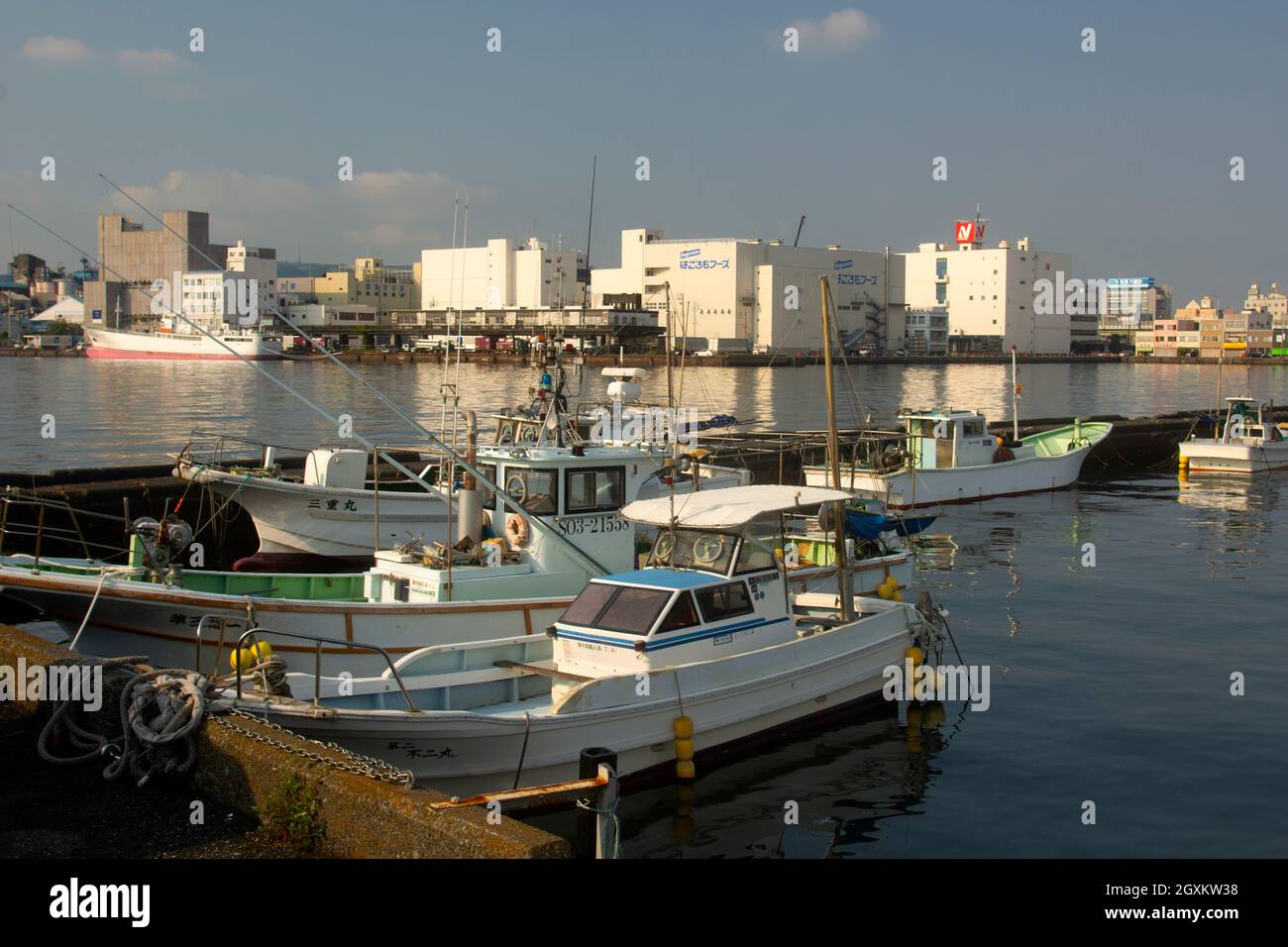 Japanese boats docked in front of the Shimizu Cultural Center Marinart, Shizuoka Port, Shizuoka, Japan Stock Photo