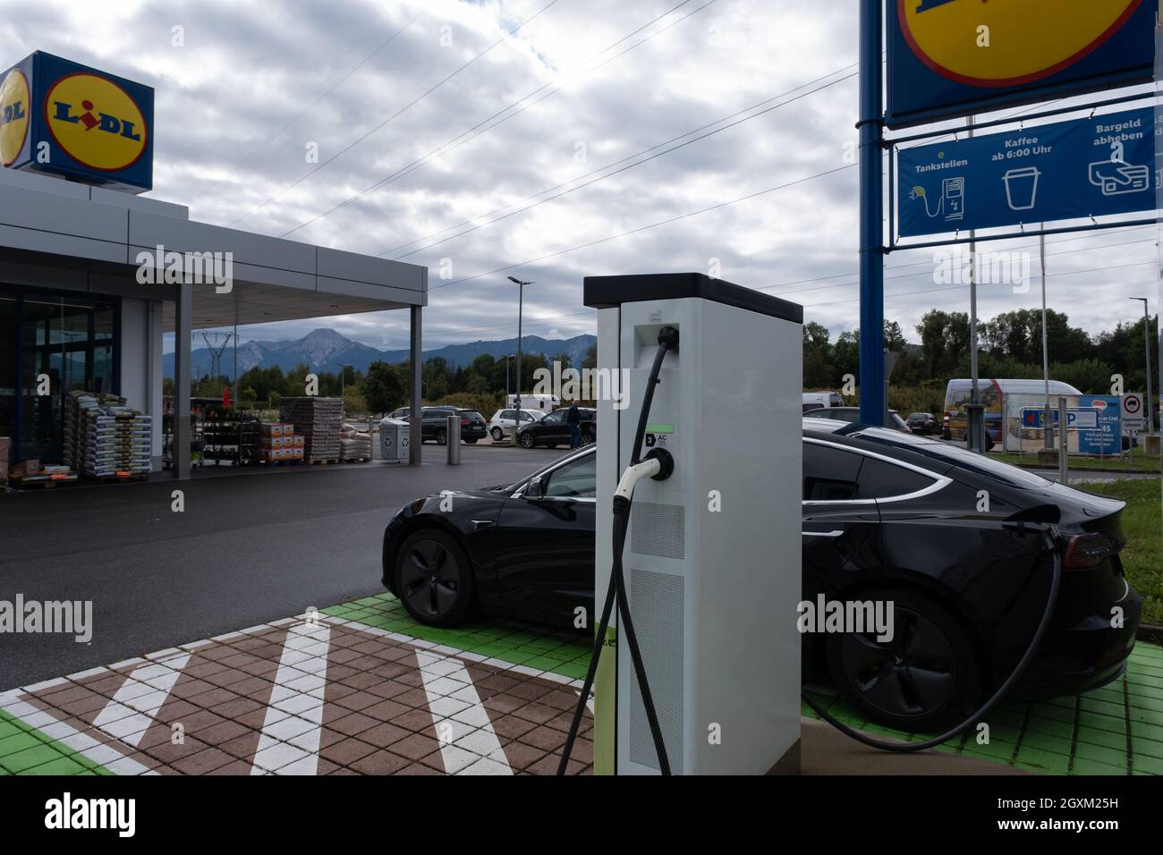 Treffen am Ossiacher See, Austria - September 30, 2021. A static shot of a  solid black Tesla Model 3 dual motor charging at LIDL supermarket Stock  Photo - Alamy