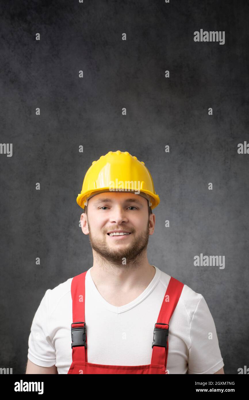 Smiling uniform hard hat hi-res stock photography and images - Alamy