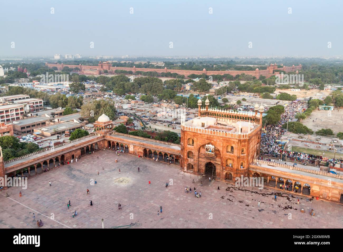 DELHI, INDIA - OCTOBER 22, 2016: Courtyard of Jama Masjid mosque in the center of Delhi, India. Red Fort in the background. Stock Photo