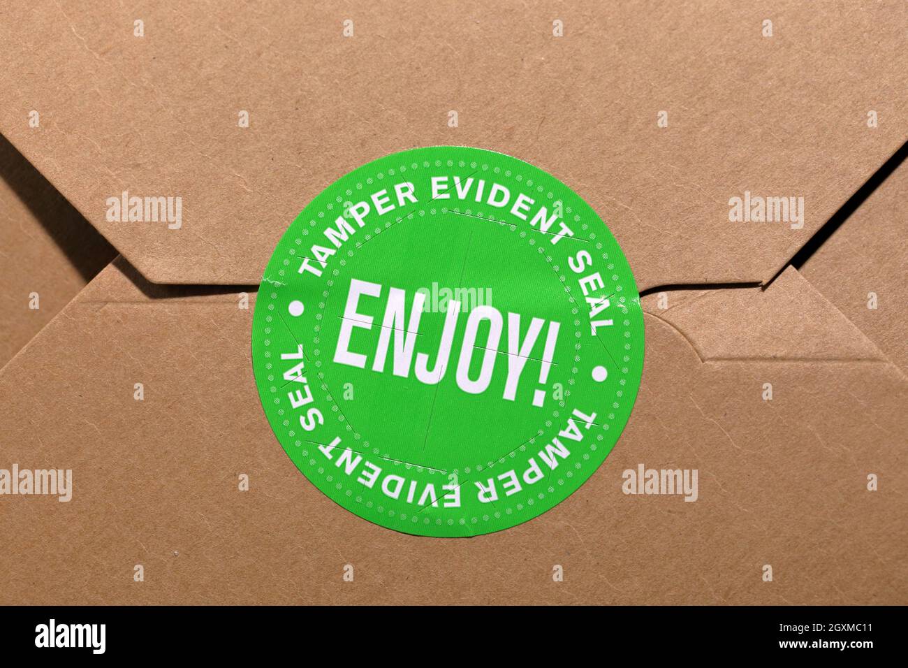 A tamper evident seal on a food container. food delivery tamper 